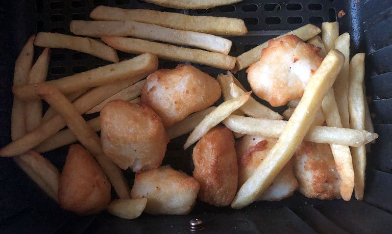 Small portion of French fries and battered cod balls