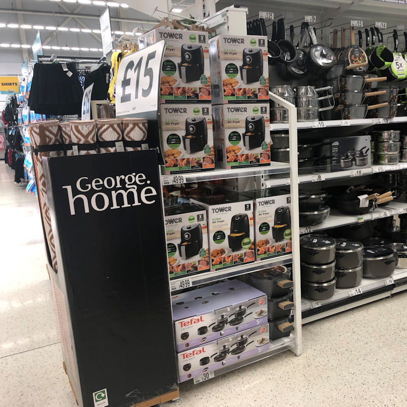 Prominent Asda air fryer display located on end of kitchenware aisle