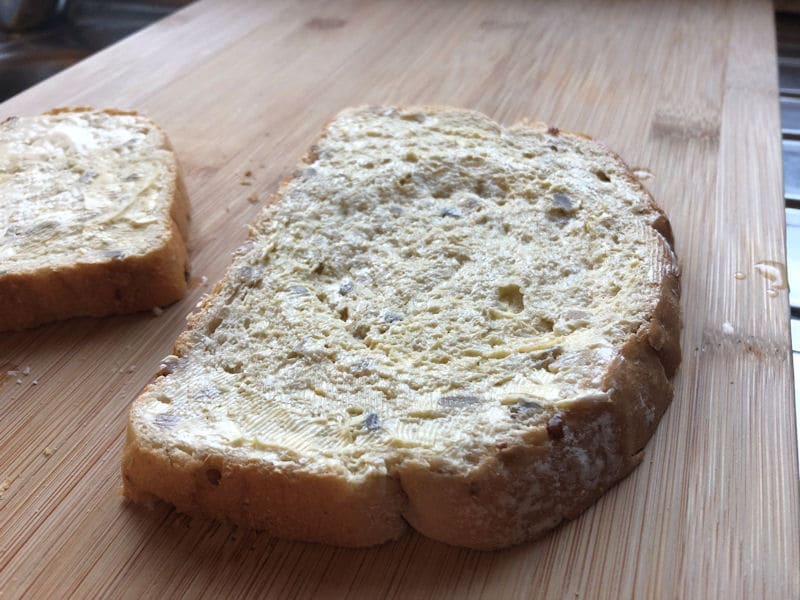 Indent made into slice of bread with use of ramekin