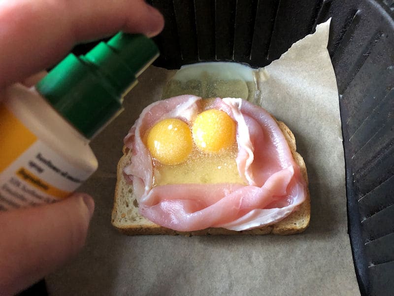 Spraying oil directly on top of raw eggs