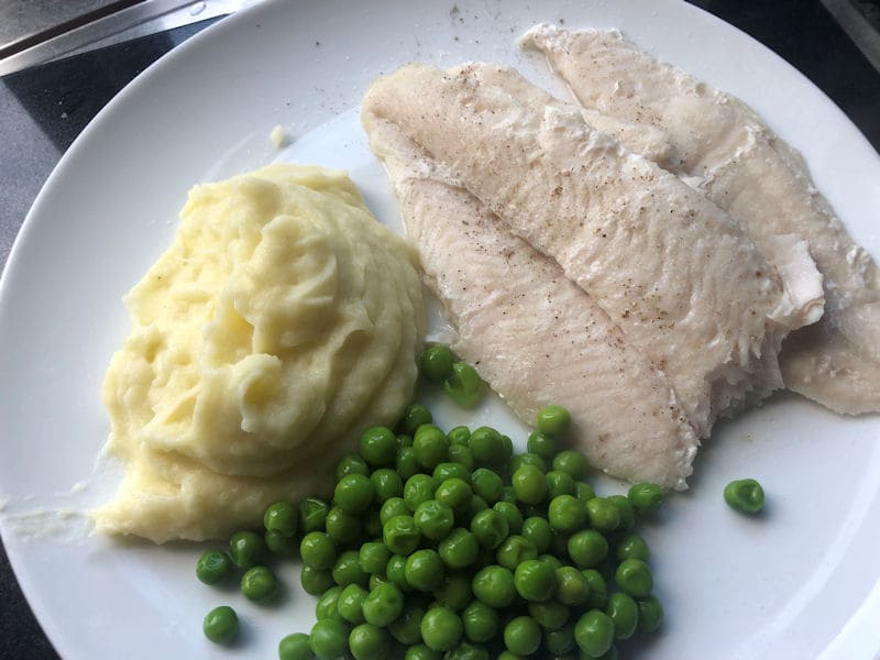 Air fried Basa fillets served with mash potatoes and peas