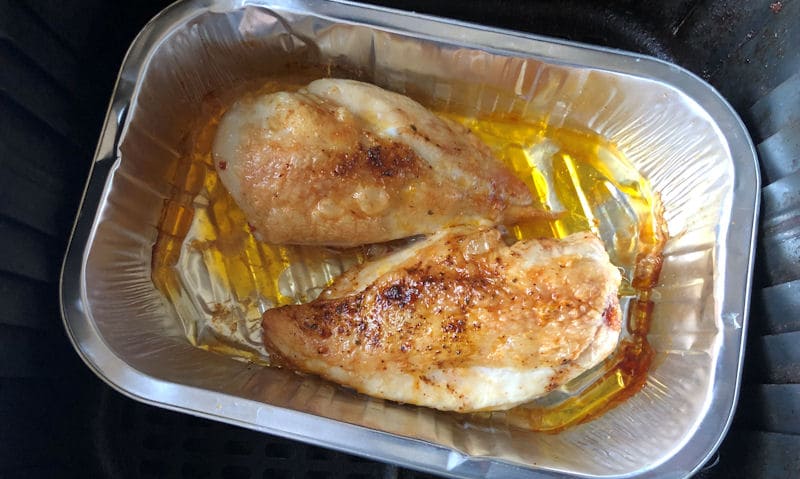 Fully cooked chicken breast fillets air fried in foil tray