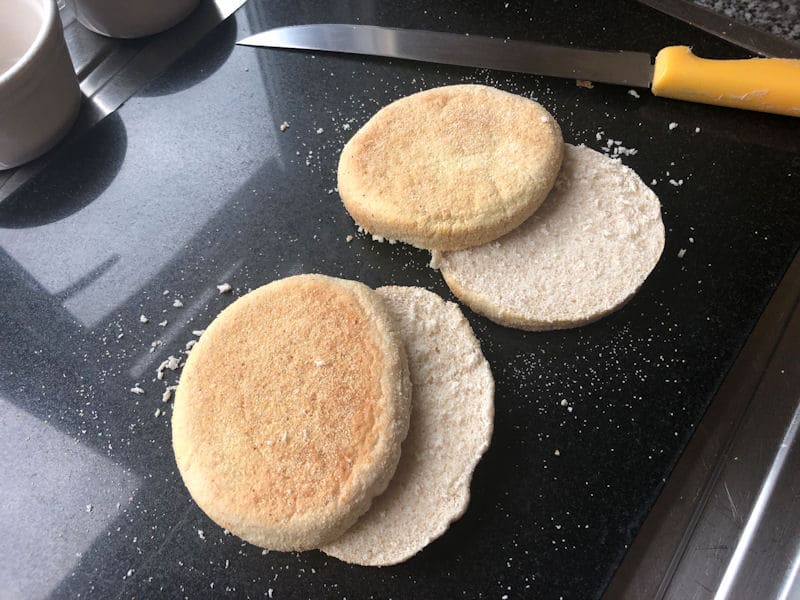 Two soft English muffins cut across in half