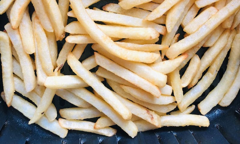 Portion of French fries directly in air fryer basket