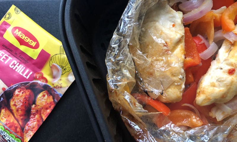 Air fried Chicken, Vegetables next to Maggi Pack displayed on chopping board