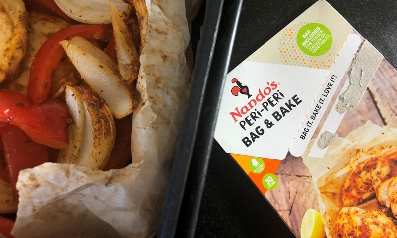 Air fried Nando's Bag & Bake with branded box on side of basket