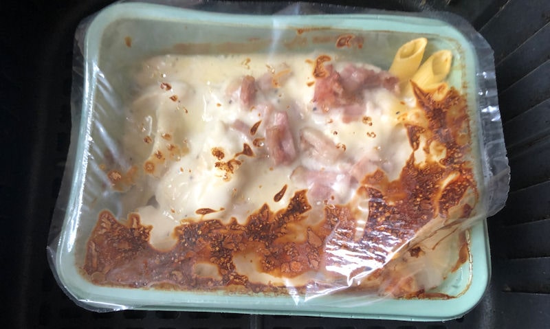 Partially air fried chicken and bacon pasta bake in plastic container