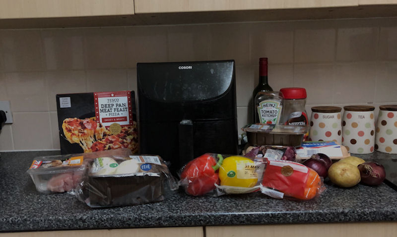 Cosori air fryer on kitchen countertop among my daily groceries