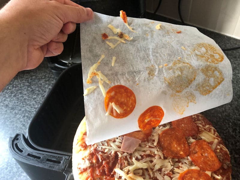 Frozen pepperoni stuck to parchment paper