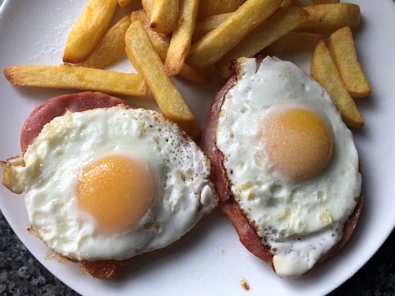 Air fried gammon steaks served with fried eggs and chips