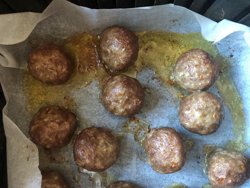 Example of beef meatball fat caught in parchment paper while air frying