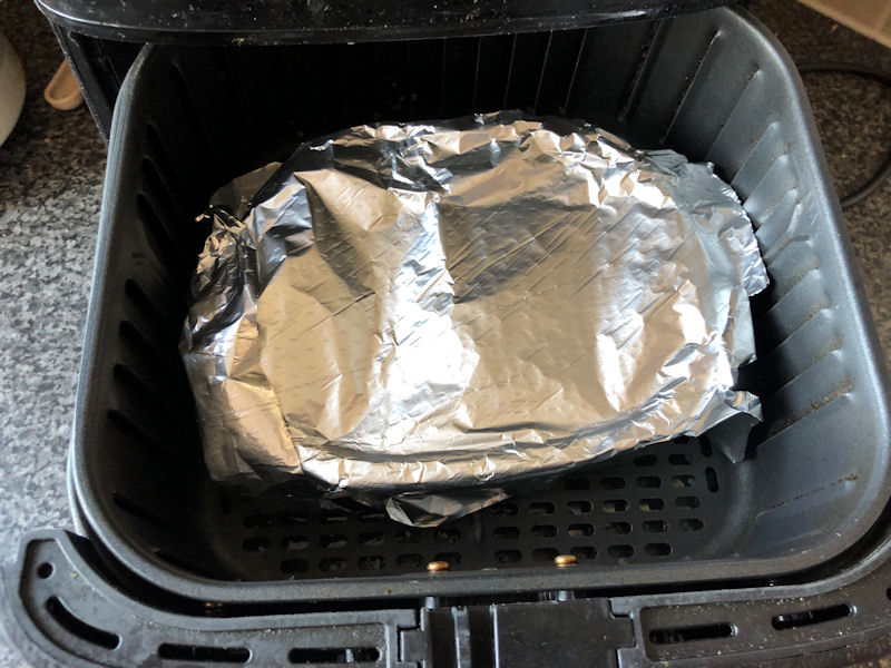 Chicken Korma ready meal with makeshift foil lid