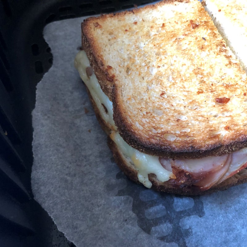 Close shot of cheese coming out of air fried toastie