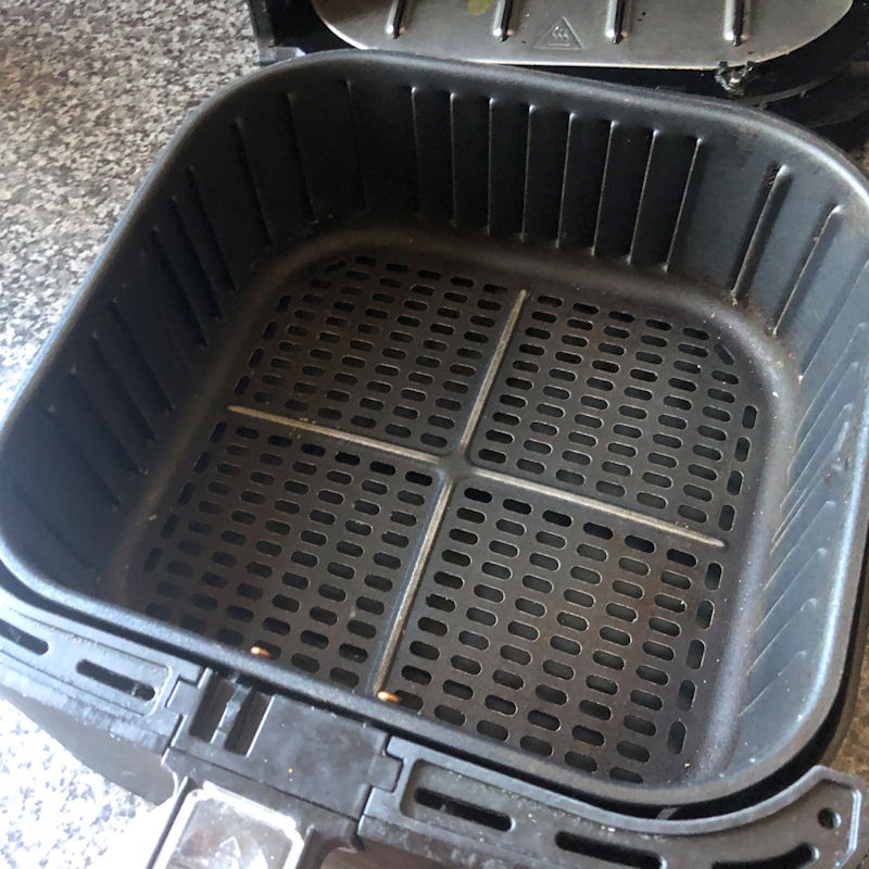 Poorly kept interior Cosori basket with baked on grease