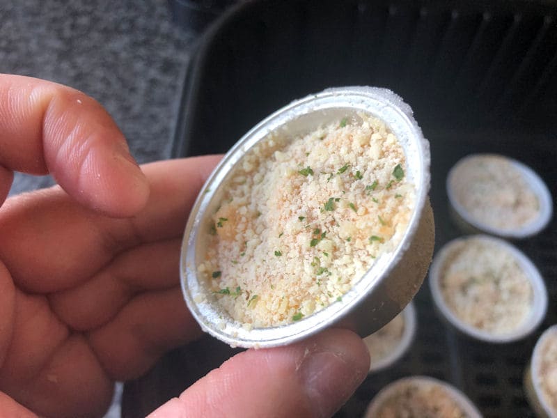 Mini Lobster Mac & Cheese appertizers in small foil trays inside air fryer