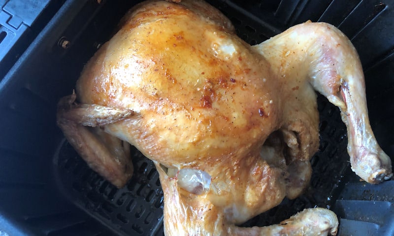 Whole small chicken cooking in my Cosori air fryer