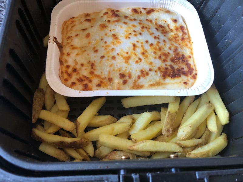 Lasagna 
  ready meal and skin on fries in air fryer basket