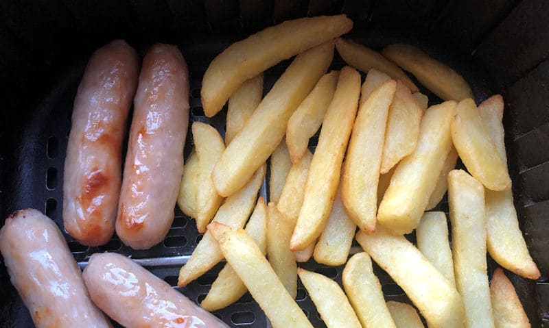 Sausages and chips together in air fryer basket