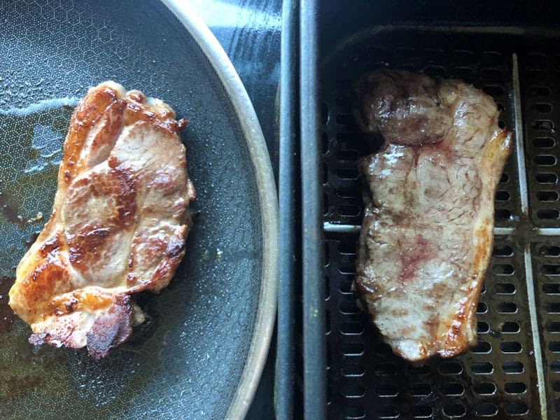 Pan fried lamb rump steak in pan next to air fried steak in air fryer basket