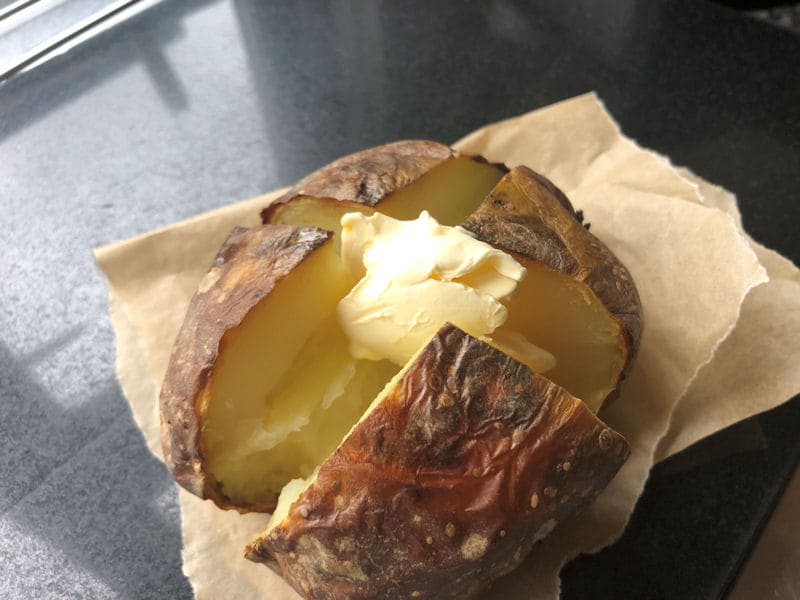 Knob of butter on cut up jacket potato