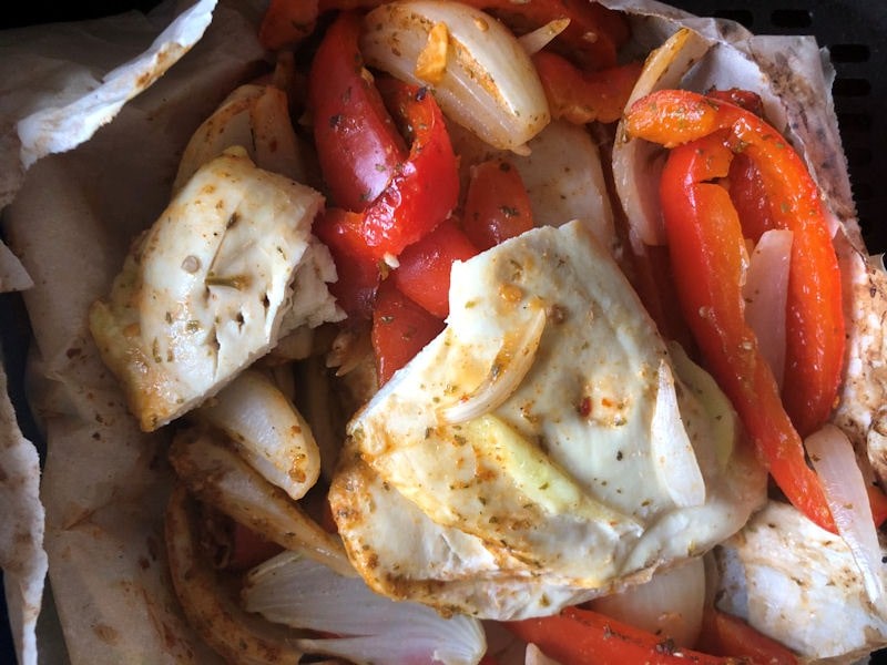 Fully cooked Nando's Bag & Bake served with peppers, onion and rice