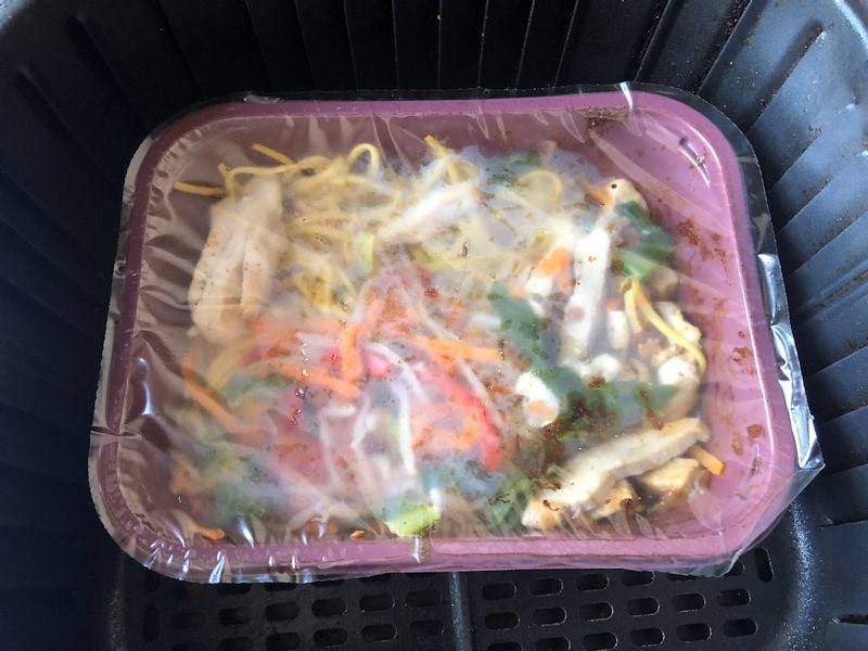 Chicken Chow Mein air fried in plastic container and film lid