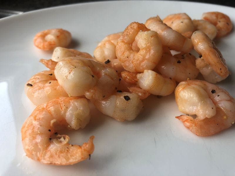 Loose cooked King Prawns on dinner plate