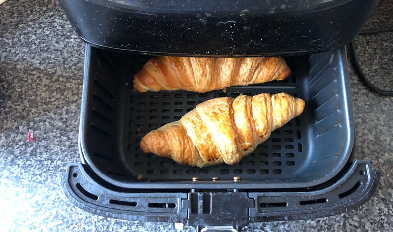 Croissants sitting in open air fryer basket