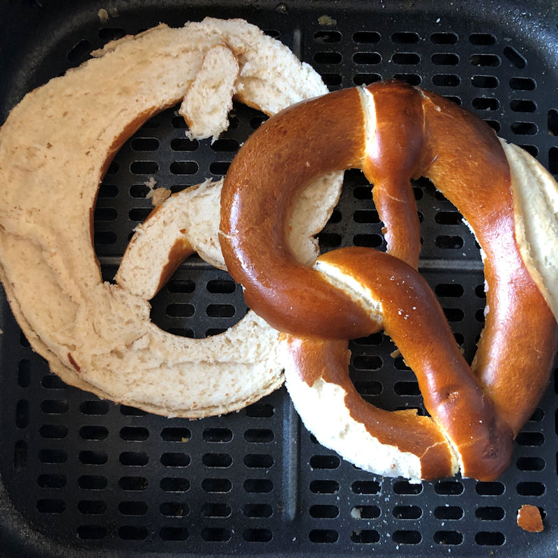 Pretzel halves inside air fryer basket