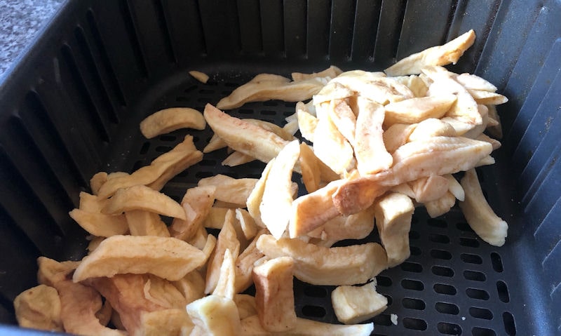 Portion of cold chips dispensed into air fryer basket