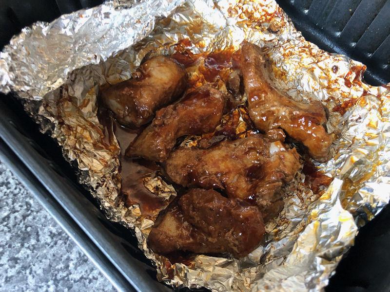 Sticky BBQ pork ribs air fried in foil parcel