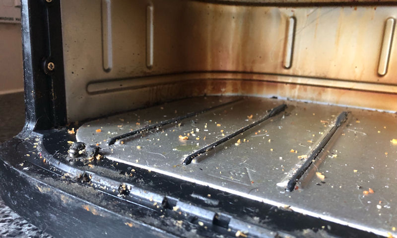 Food debris spread out on floor of air fryer drawer