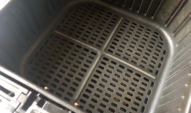 Clean Cosori air fryer basket interior