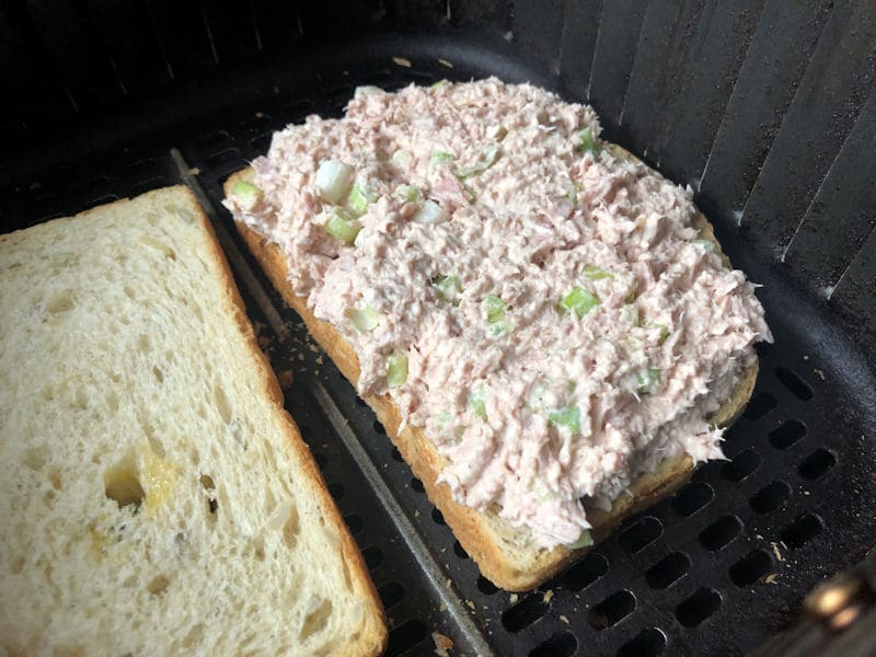 Freshly made tuna melt mix evenly spread on air fried toasted bread